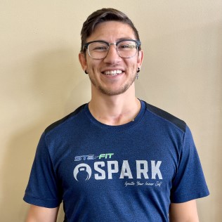 man with glasses smiling